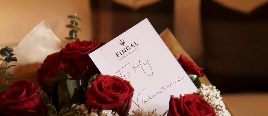 Bouquet of red roses with a note saying to my valentine