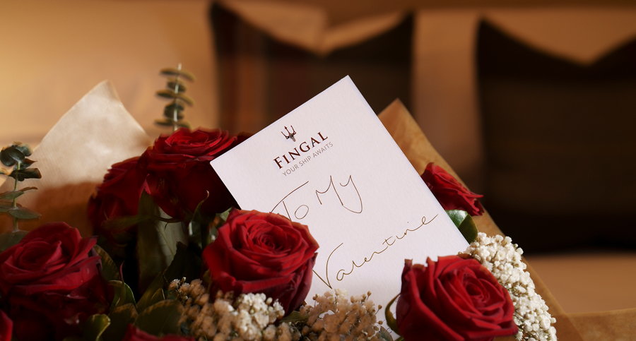 Bouquet of red roses with a note saying to my valentine