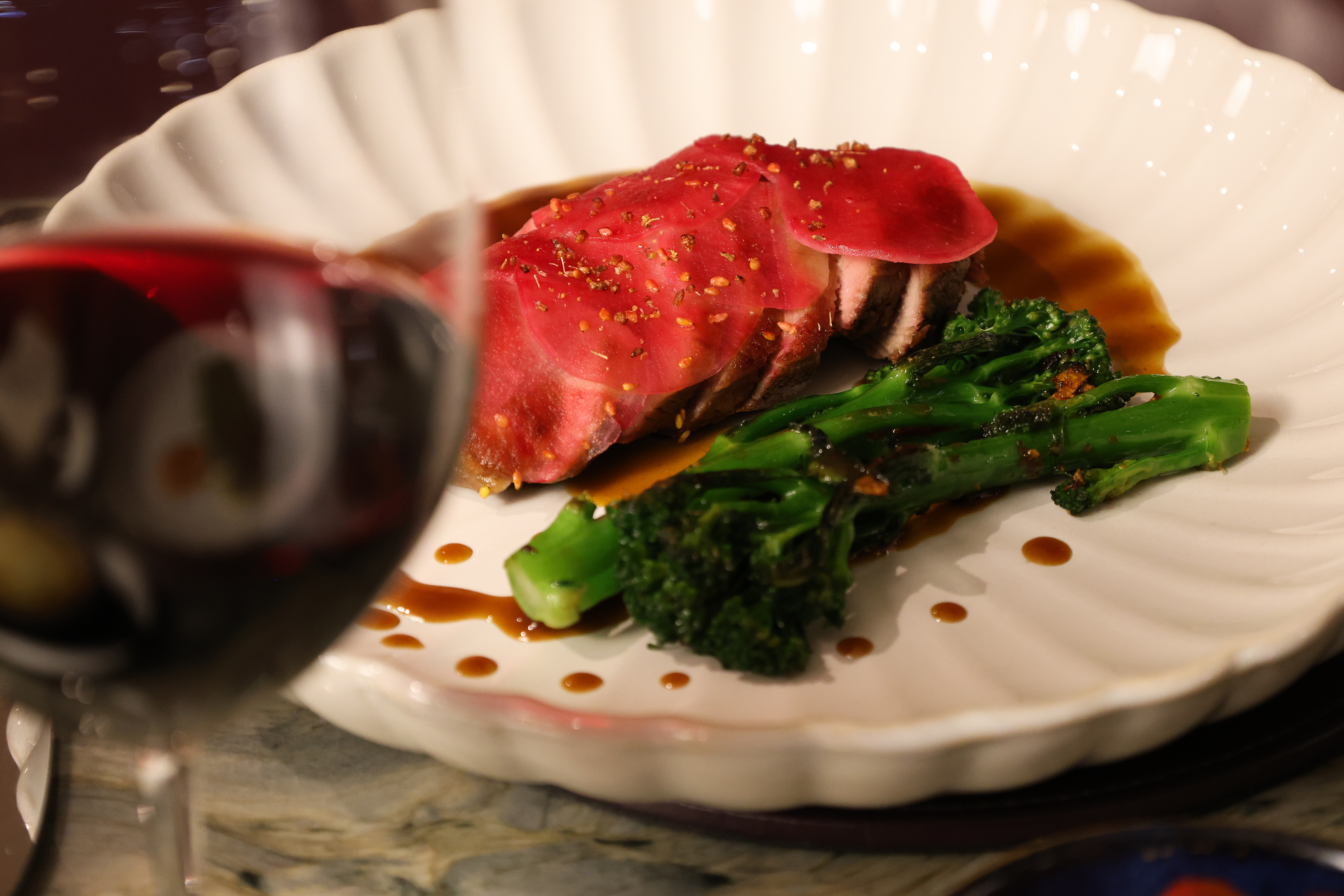Roasted Devon duck breast, sweet-marinated mooli, broccolini, sauce bigarade  