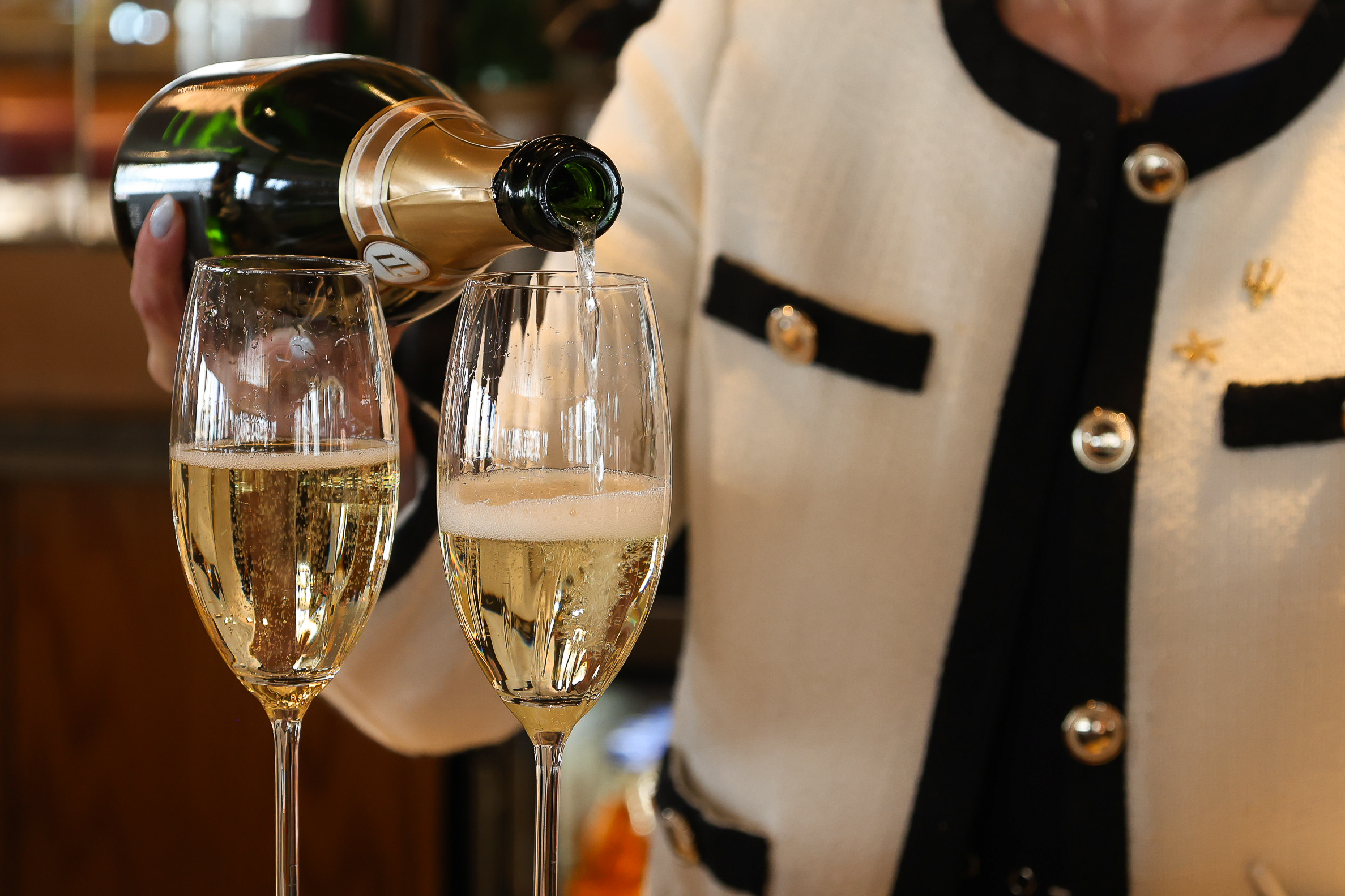 Champagne Pouring In Two Glasses