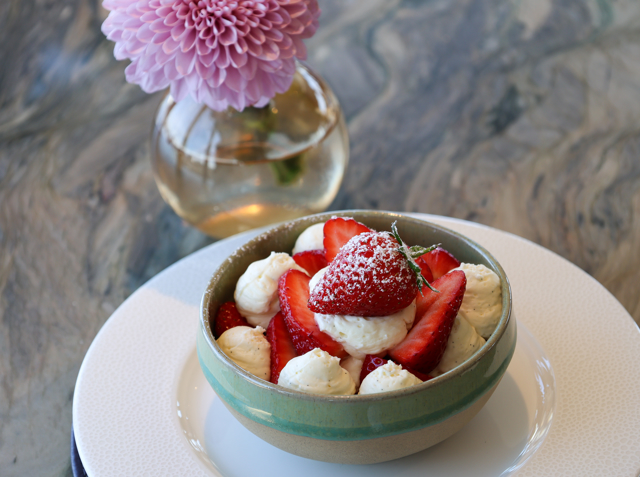 Bowl on table containing Perthshire strawberries with vanilla cream from the Fingal Edinburgh afternoon tea menu
