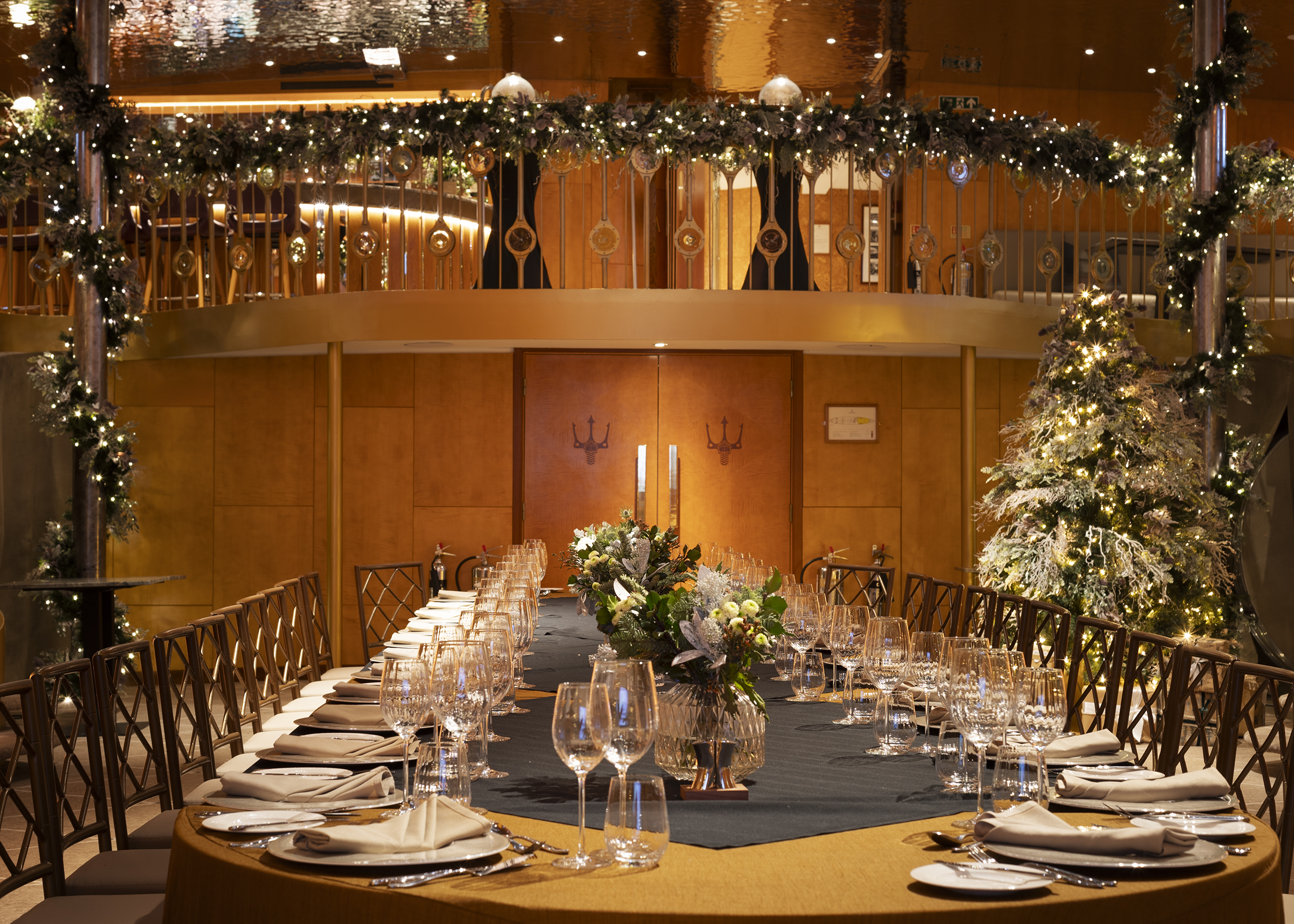 Christmas dining room table in large private dining room, decorated for Christmas in the ballroom aboard Fingal luxury Edinburgh Restaurant & hotel.